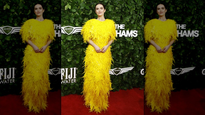 Zoey Deutch posing in all yellow