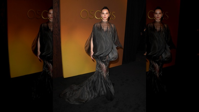 Hailee Steinfeld in a black dress on the black carpet of the Governors Awards.
