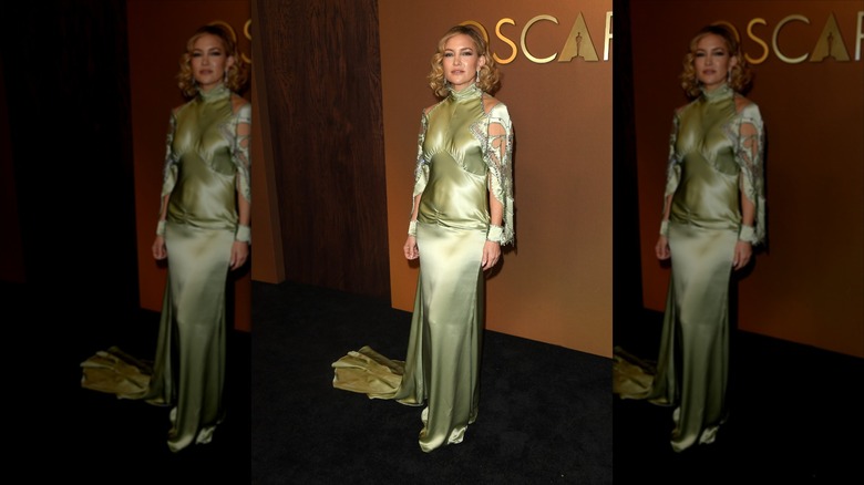 Kate Hudson in a pale green dress on the black carpet of the Governors Awards.