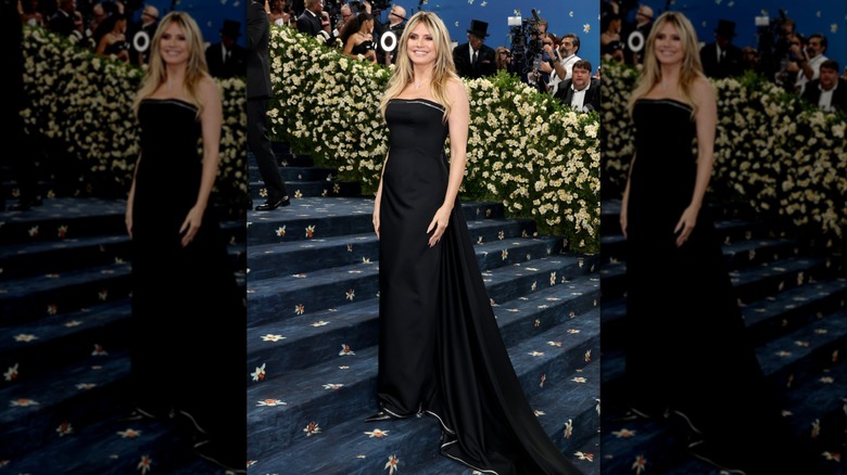 Heidi Klum posing in plain black dress