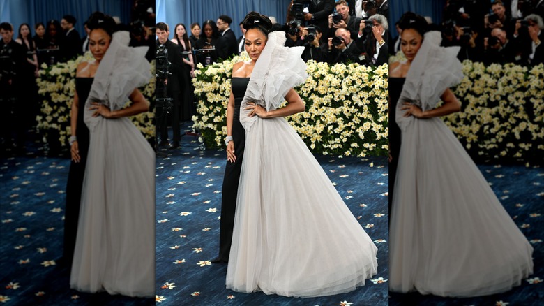 La La Anthony wearing half sleek, half gauzy dress