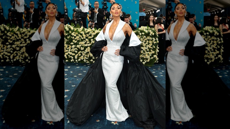 Nicole Scherzinger poses in white dress