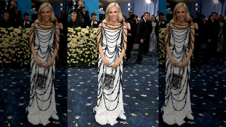 Tory Burch poses in white dress with chains