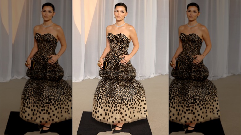 Inde Navarrette smiles in a black-and-tan spotted dress