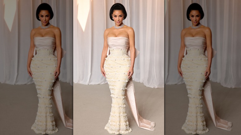 Kim Kardashian in a cream dress