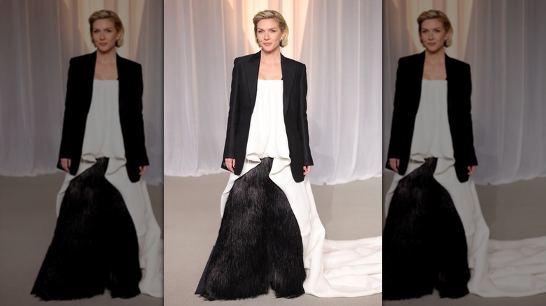 Rhea Seehorn smiles in a black-and-white outfit