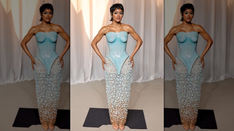 Teyana Taylor posing in a blue dress