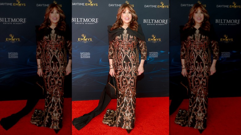 Kate Linder in a busy gown on the red carpet