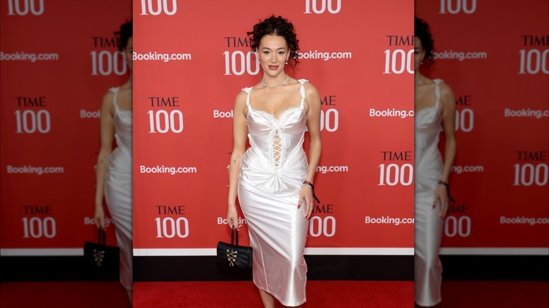 Jess Val Ortiz in a white dress with corset top