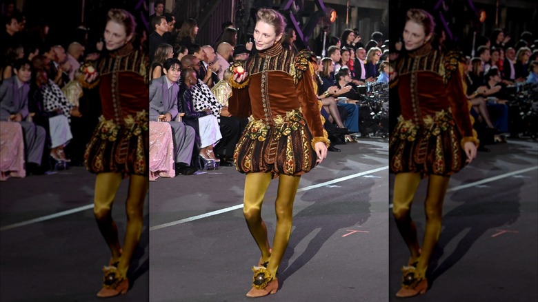 Hunter Schafer walking down the runway