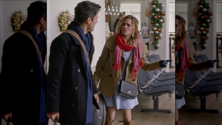 Bethany Joy Lenz talking in a dress, coat, and oversized scarf