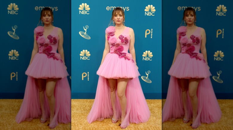 Kaley Cuoco smiles in pink floral dress
