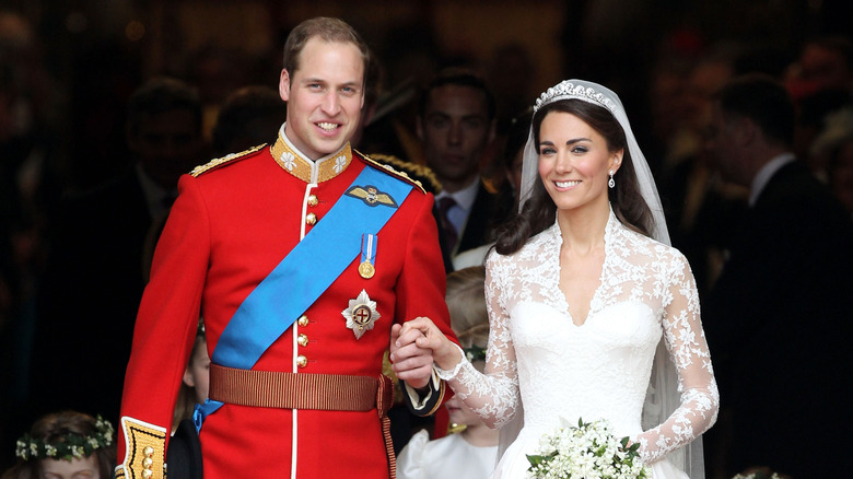 Prince William and Catherine Middleton holding hands after their wedding