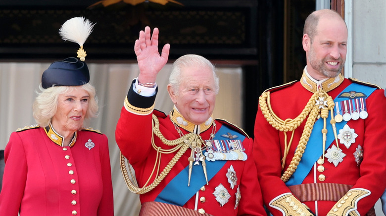 Queen Camilla, King Charles, and Prince William standing together