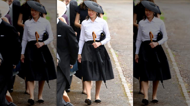 Lady Sarah Chatto walking with an umbrella