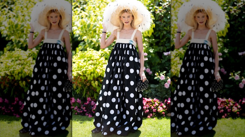 Georgia Toffolo in large, shapeless polka dot dress and huge, fluffy hat