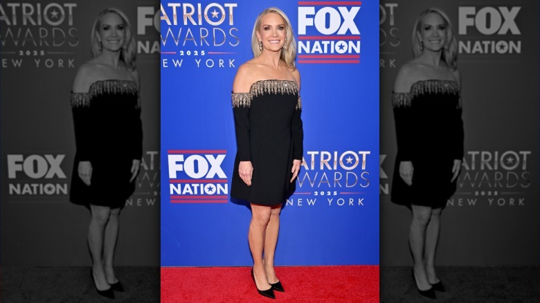 Dana Perino posing on the red carpet in a black mini.