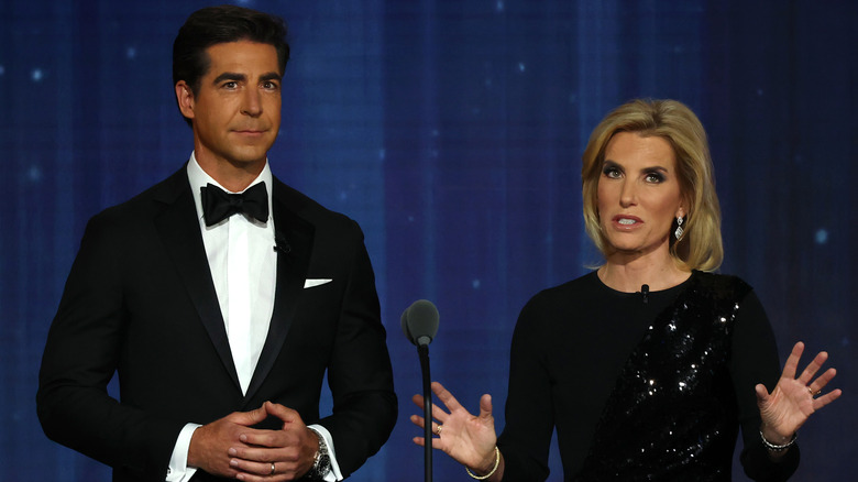 Jesse Watters and Laura Ingraham on stage together.