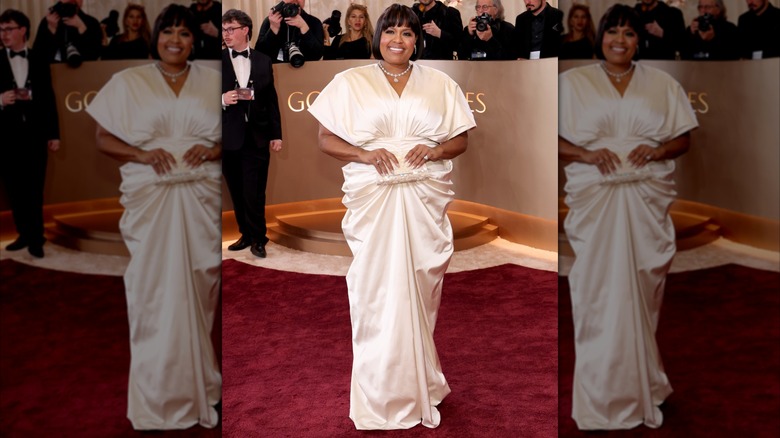 Natasha Rothwell wearing a white dress with gathering on the front on the red carpet