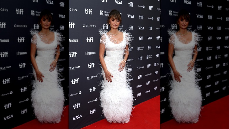 Penelope Cruz wearing a white fringe dress on the red carpet