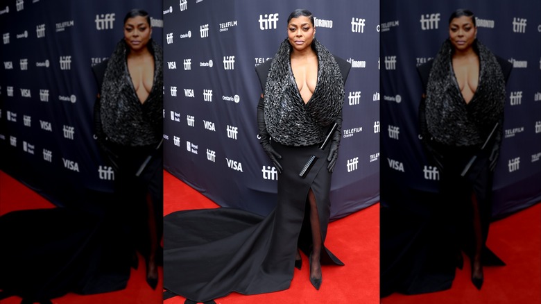 Taraji P. Henson wearing a black gown and gloves on the red carpet