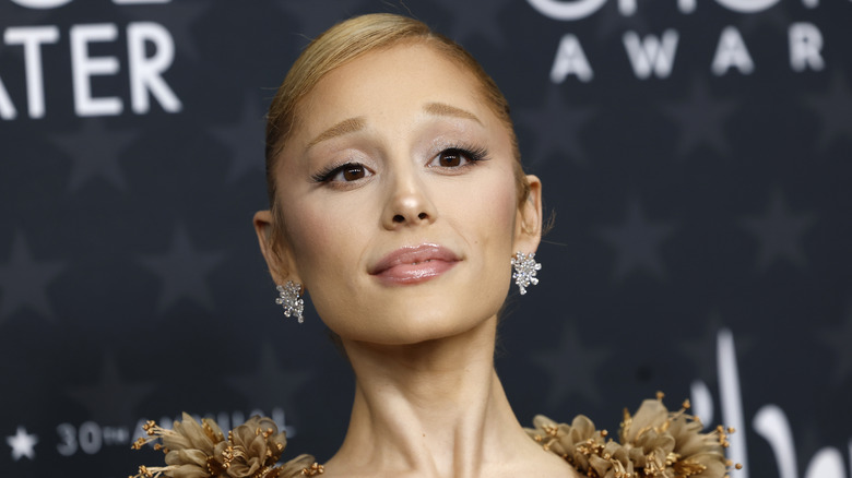 Closeup of Ariana Grande with golden hair and dress