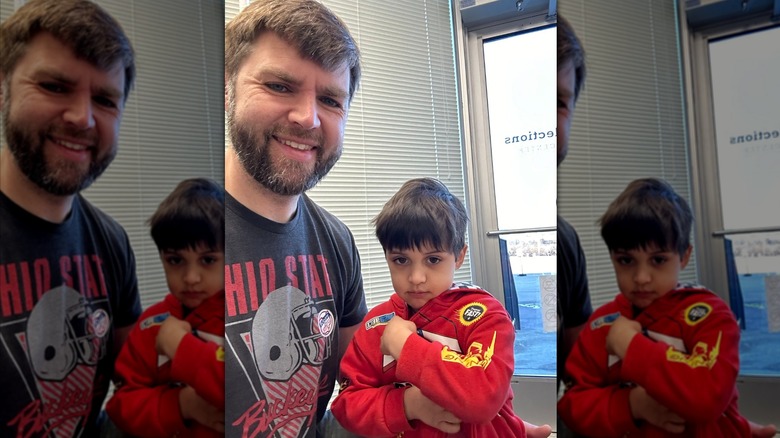 JD Vance smiles for a photo with his son