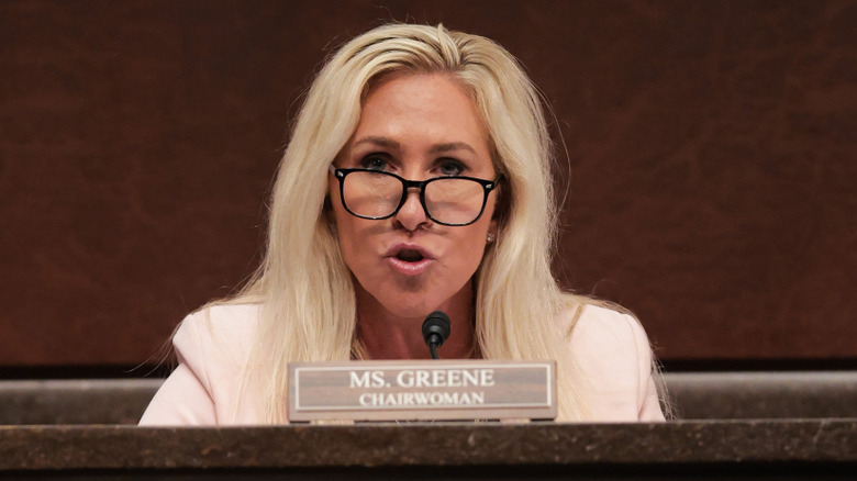 Marjorie Taylor Greene speaking into microphone
