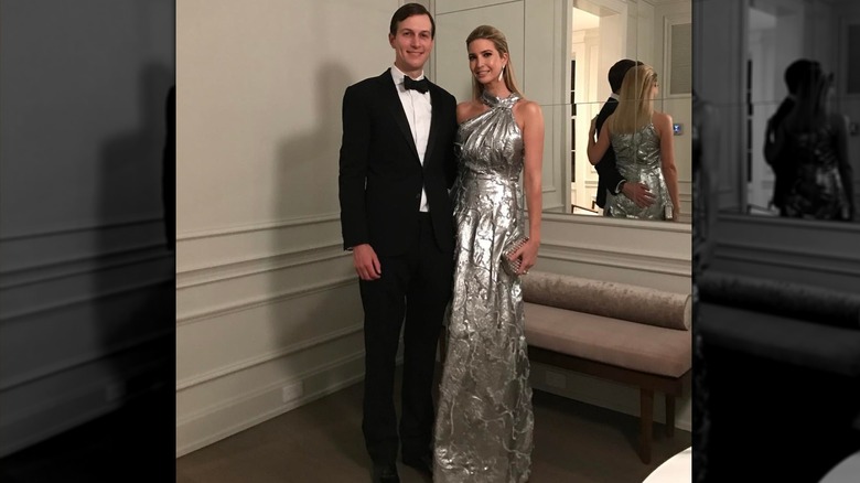 Jared Kushner and Ivanka Trump posing for a photo in formal attire in 2017