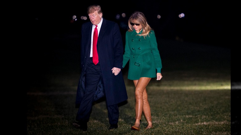 Donald and Melania Trump walking on the White House's South Lawn in 2018