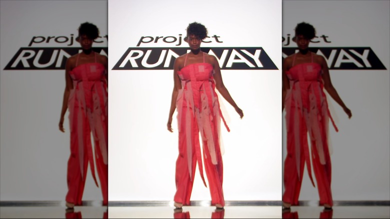 A model wears Aaron Myers' pink ensemble on the runway
