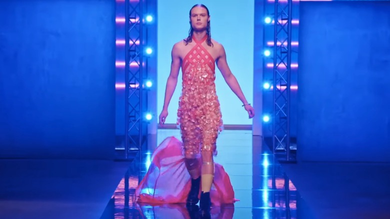 A model walks the runway in Fabio Costa's coral-colored dress on "Project Runway"