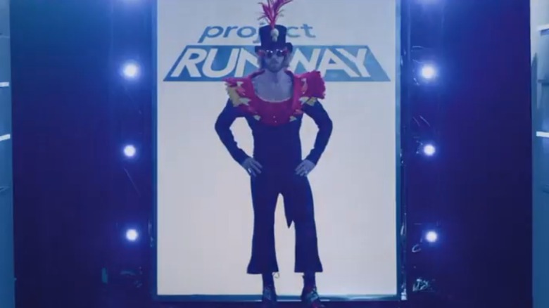 A model in Hester Sunshine's Elton John inspired outfit stands on the runway