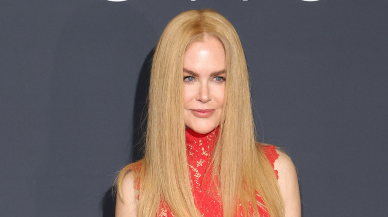 Nicole Kidman wearing a red dress and malfunctioning wig at Cannes