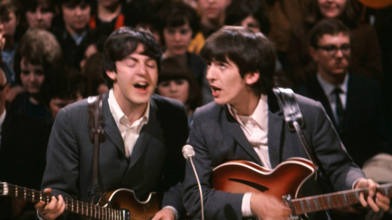 Paul McCartney and George Harrison pictured performing on 1960's TV Show.