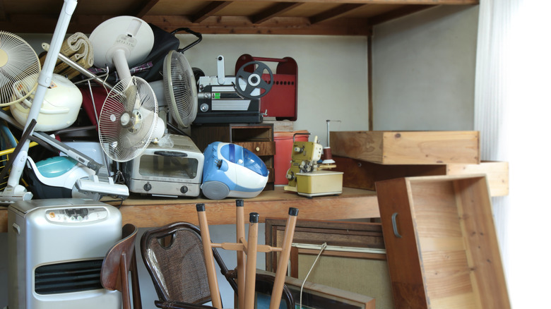 A cluttered collection of old household items