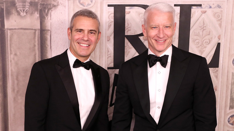 Andy Cohen and Anderson Cooper smiling