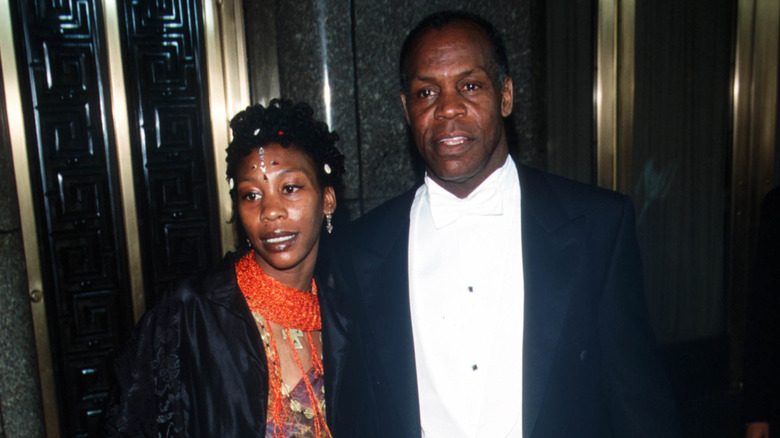 Danny Glover and his daughter, Mandisa, posing for the cameras together at a film premiere in 2000