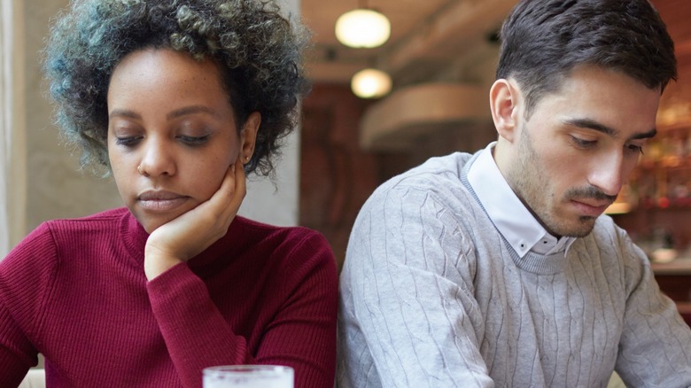 Couple distracted by phones