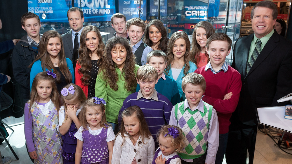 The Duggar family posing