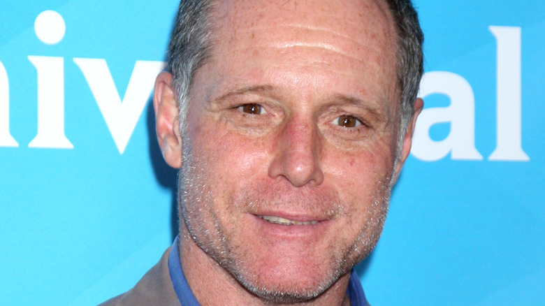 Jason Beghe poses on the red carpet