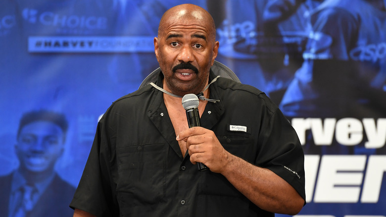 Steve Harvey speaking onstage