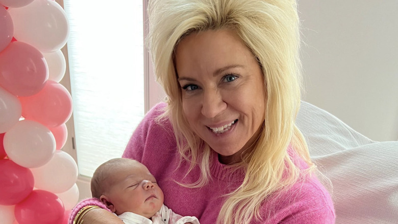 Theresa Caputo holding a baby