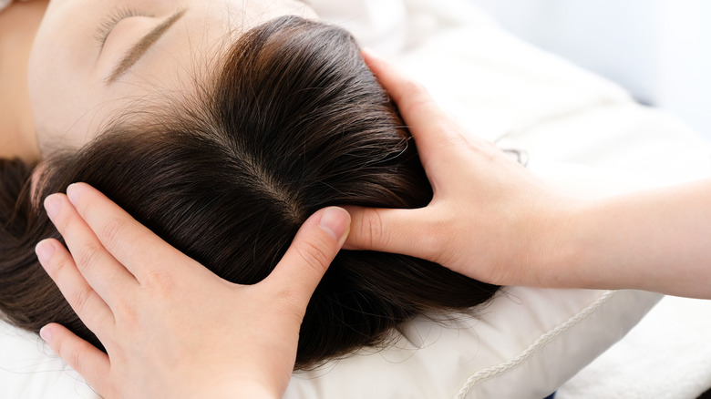 Woman receiving acupressure 