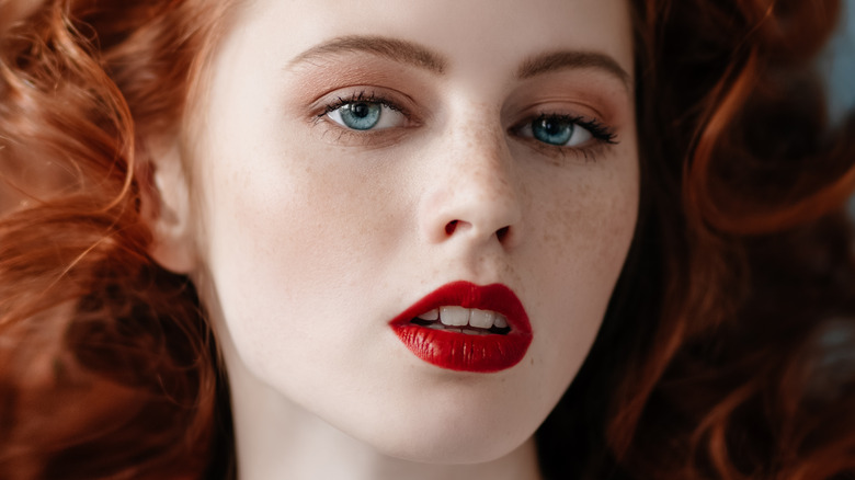 closeup of woman with red hair and red lipstick