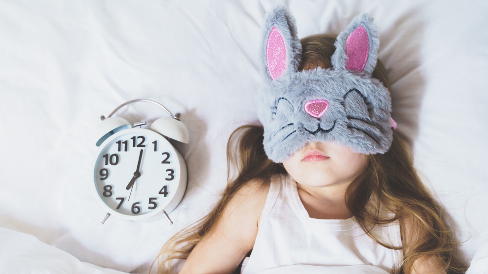 Girl sleeping with a sleep mask