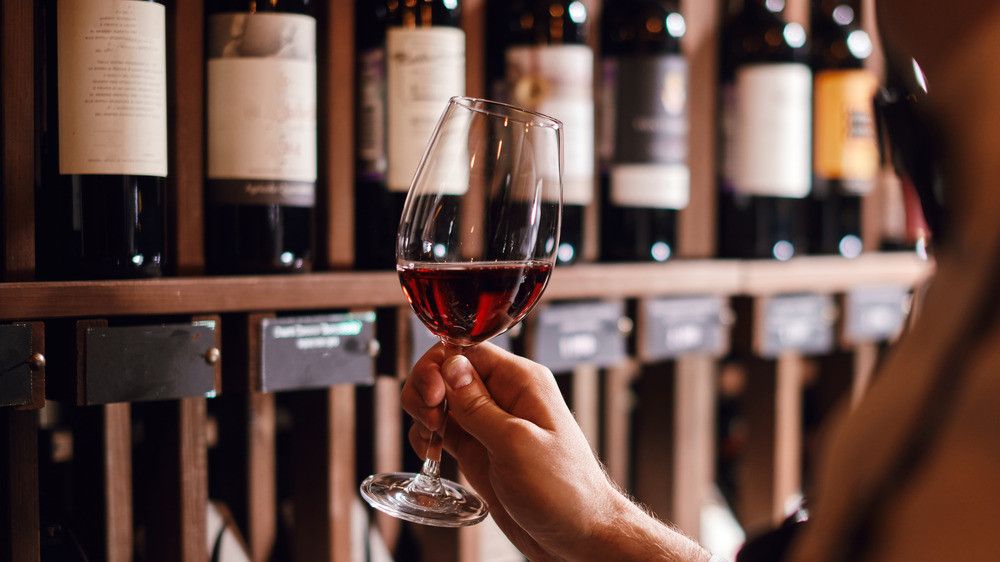 A man holding a glass of wine