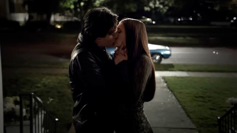 Damon and Elena smooching on The Vampire Diaries