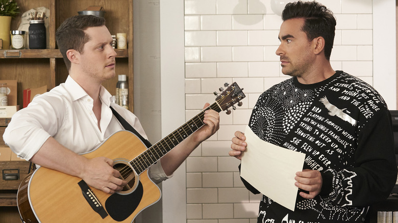 Patrick serenading David on Schitt's Creek