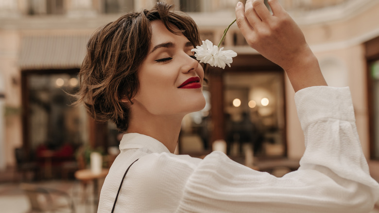 Woman holding flower